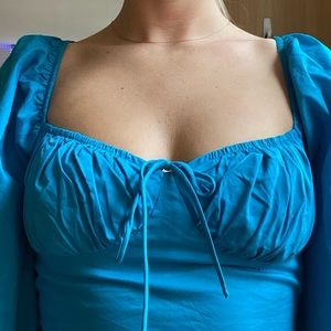 Beautiful blue princess polly crop top w/ puffy sleeves w/ tie in the front!